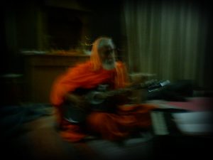 Bansi Baba playing guitar