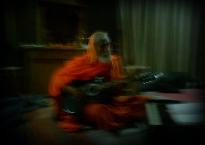 Bansi Baba playing guitar